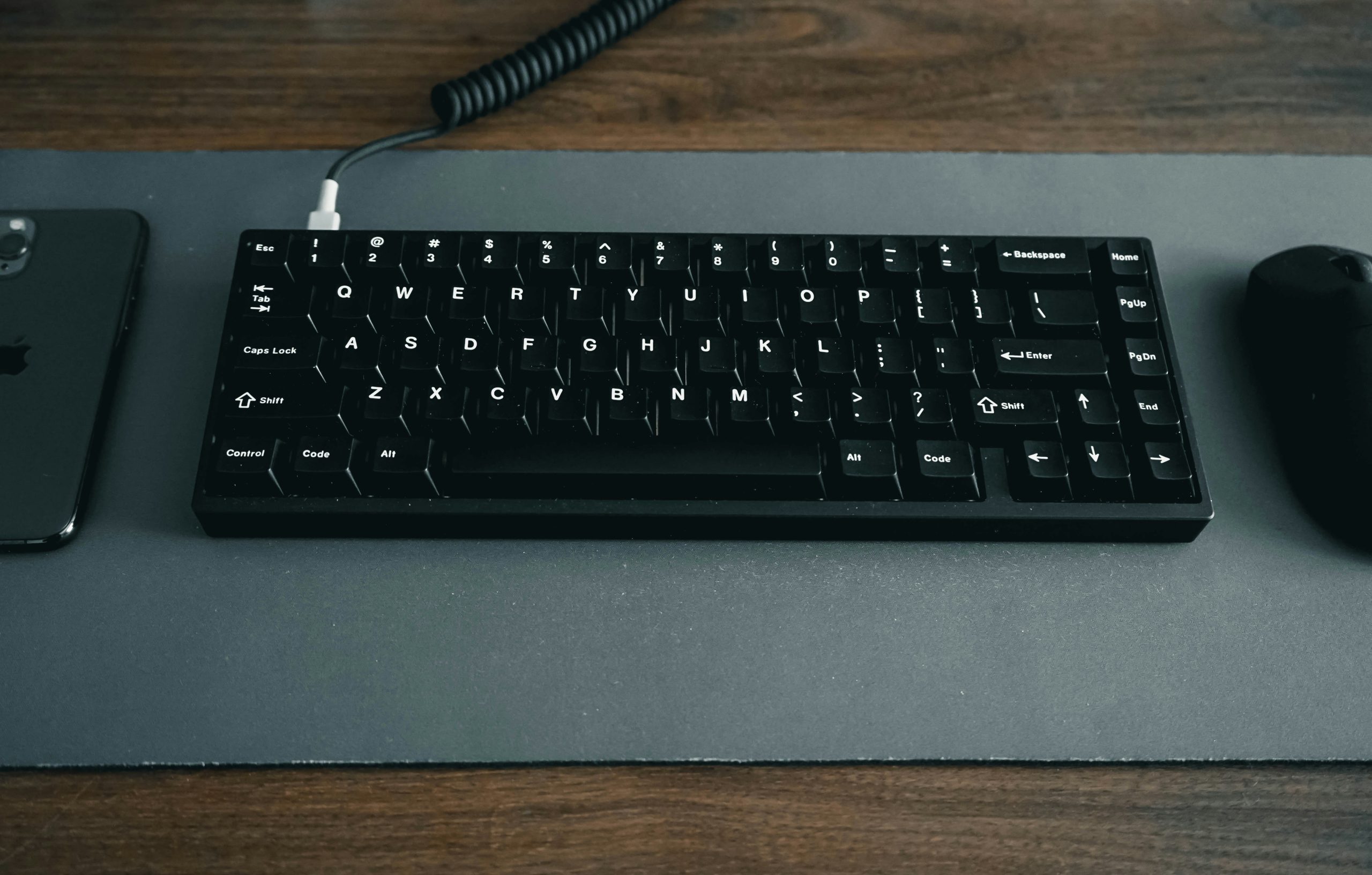 Precise Trading Execution Hands near a keyboard and mouse, symbolizing the precise execution strategies used in trading platforms like Coinstrat Pro to minimize slippage.