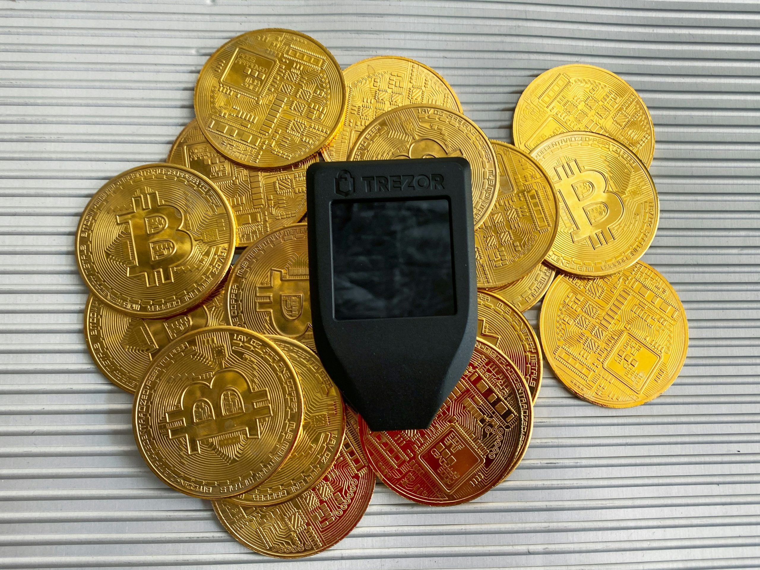Crypto Platform Risks A close-up of a smartphone screen showing a cryptocurrency trading app with red, downward-trending charts, symbolizing the inherent risks in crypto platforms.