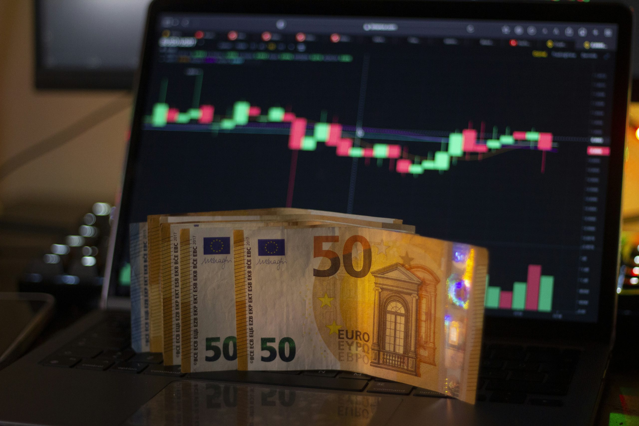 A person engaging with a multi-asset social trading platform on a mobile device, demonstrating how diverse instruments and copytrade features enhance client retention for IBs.