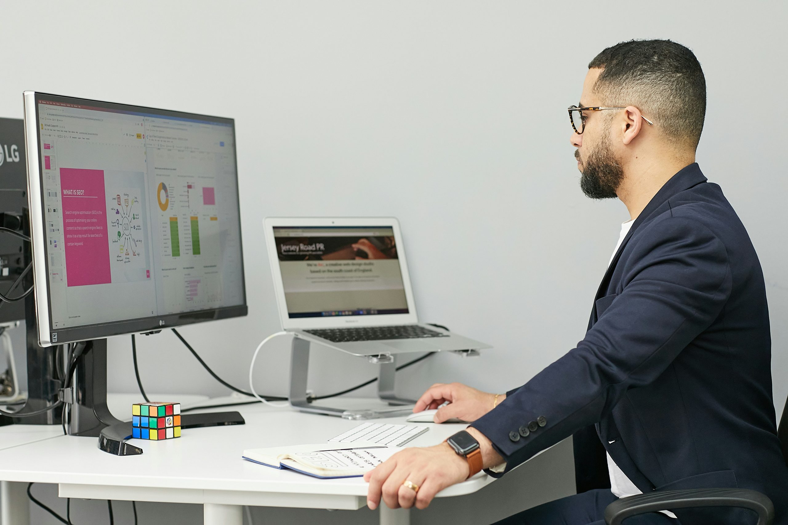Close-up of hands typing on a laptop, displaying advanced financial charts and cryptocurrency signals, symbolizing the monetization of trading expertise.