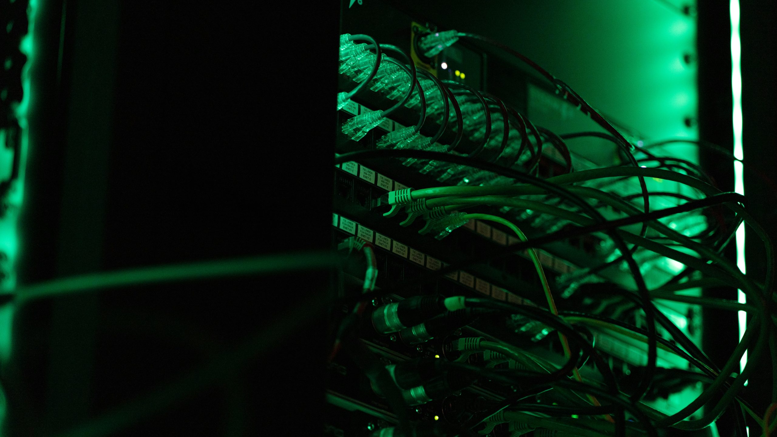 A sophisticated server room with interconnected machines and flashing lights, symbolizing the complex backend infrastructure of a trading brokerage.