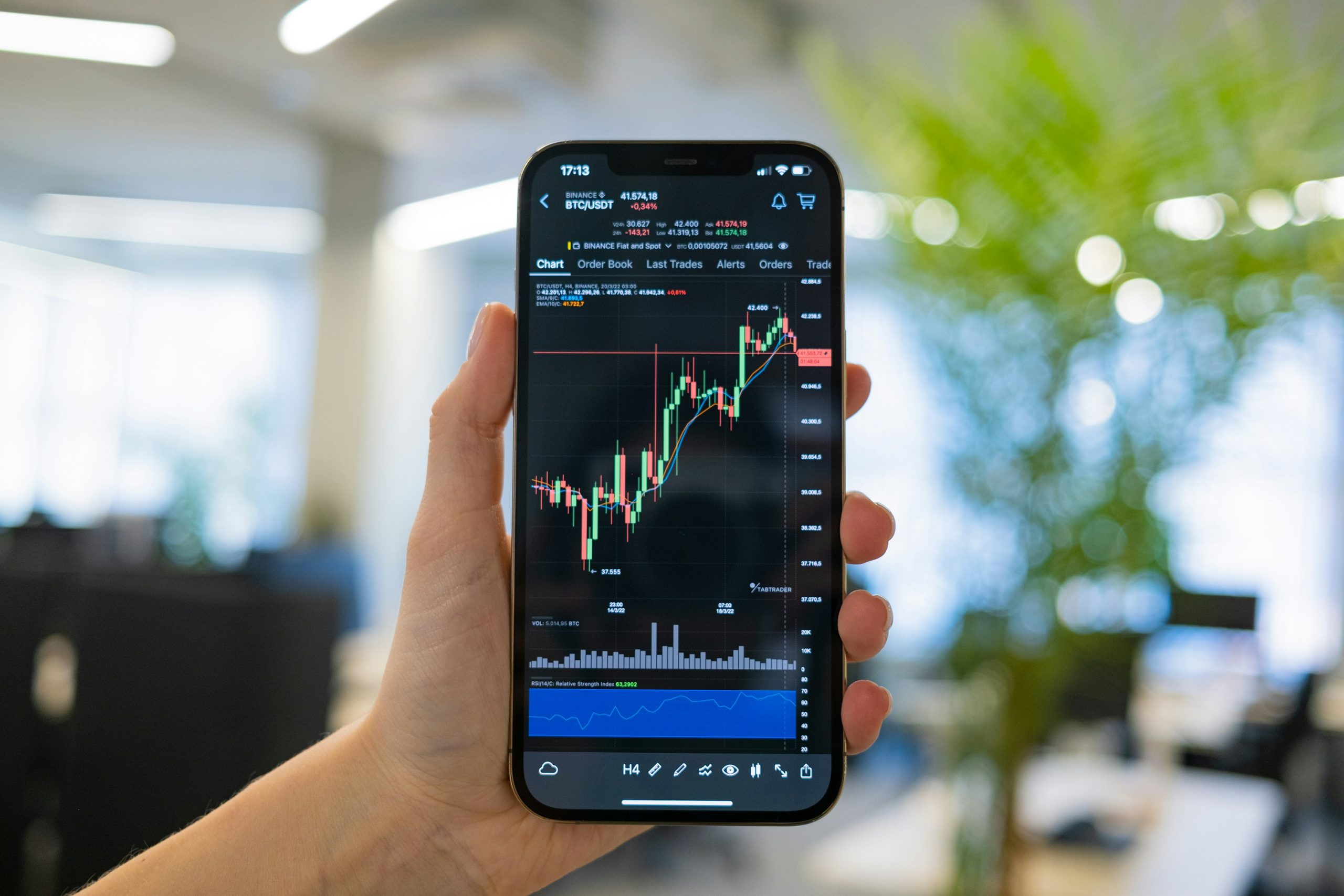 A trader's desk with multiple monitors displaying a mix of cryptocurrency and forex charts, symbolizing the hybrid brokerage model.