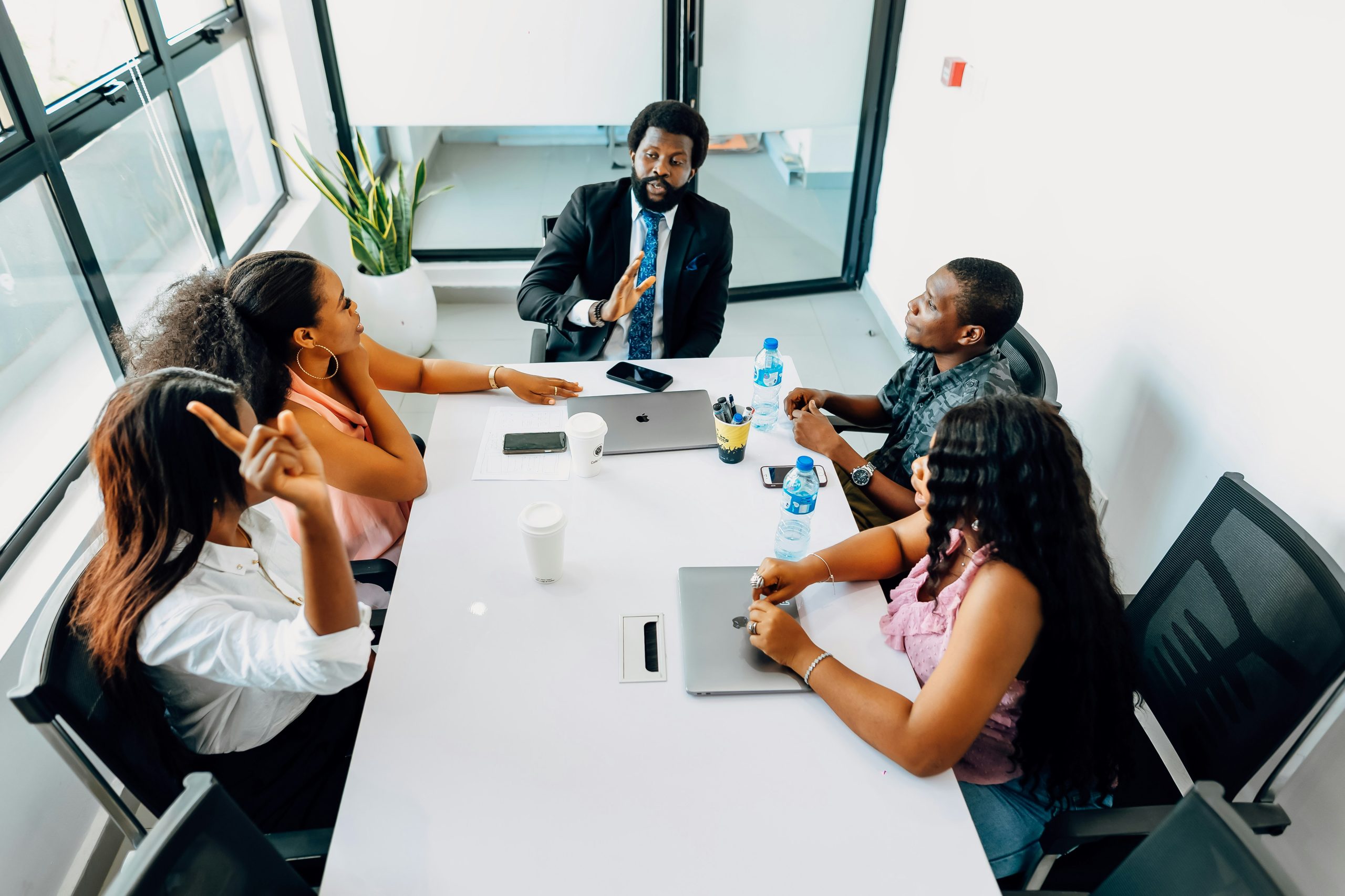 Professional fund managers discussing advanced monetization strategies and portfolio management in a collaborative office setting.