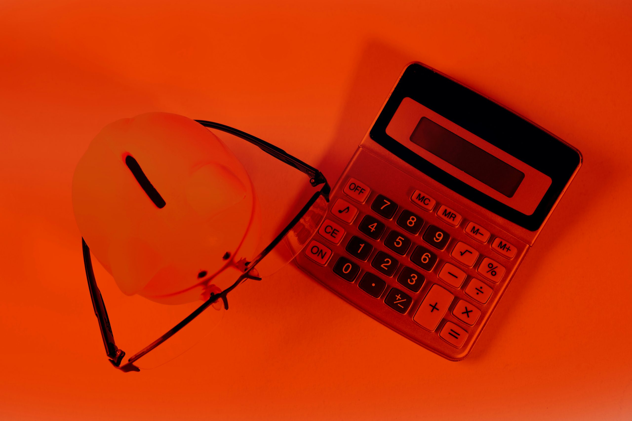A hand interlocking a gear into a multi-layered mechanical system, representing the strategic implementation of tiered commission structures in a forex affiliate network.